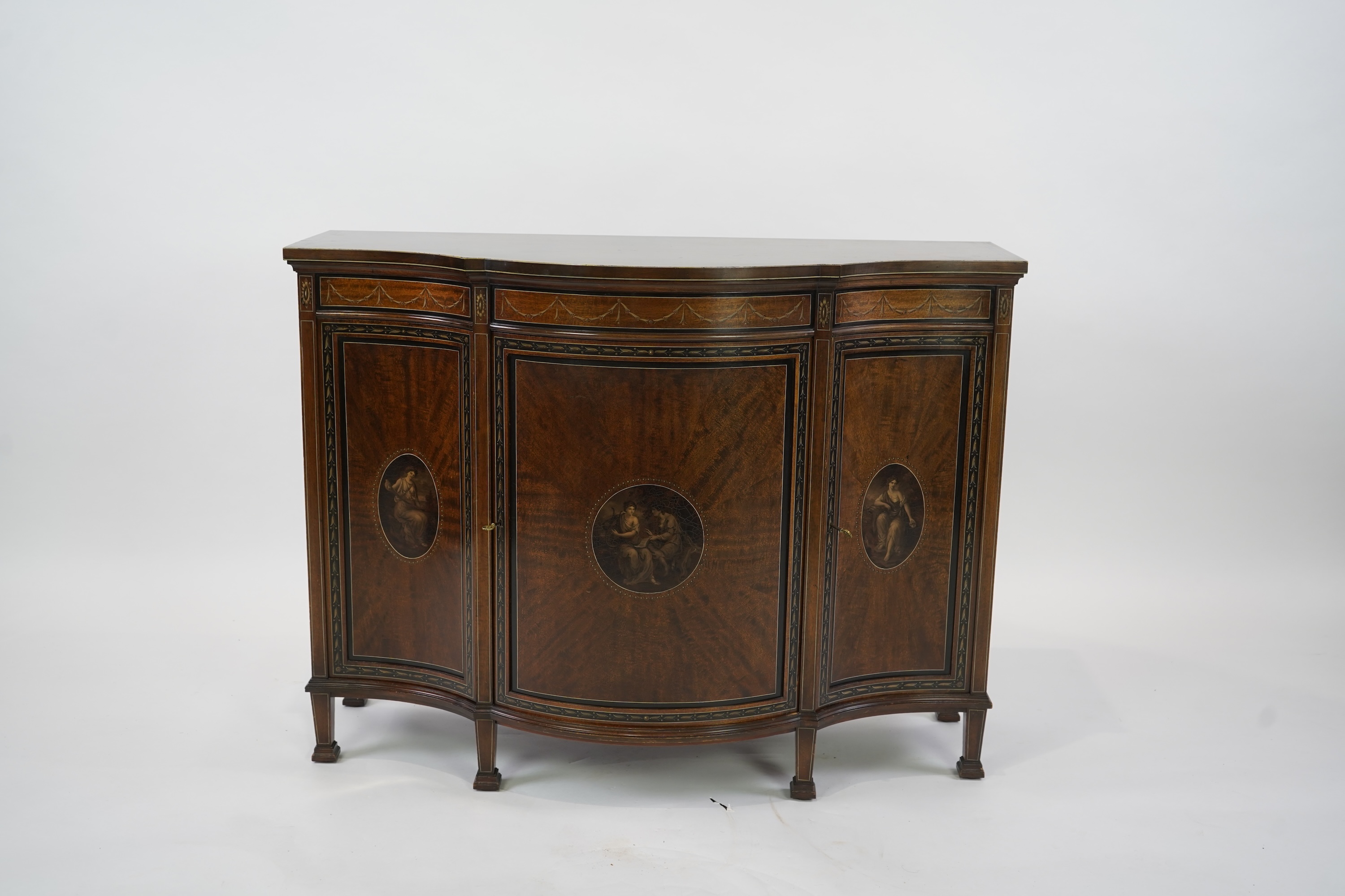 An Edwardian Sheraton Revival painted mahogany bowfront side cabinet